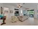 Cozy living room with comfortable seating, decorative accents, and access to an outdoor patio at 1025 Seagrape Dr, Ruskin, FL 33570