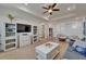 The living room features hardwood floors, a ceiling fan, and comfortable seating at 1025 Seagrape Dr, Ruskin, FL 33570