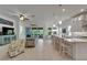 Open-concept living room and kitchen with bar seating and comfortable furniture at 1025 Seagrape Dr, Ruskin, FL 33570