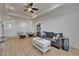 Spacious living room with hardwood floors, ceiling fan, and cozy seating area at 1025 Seagrape Dr, Ruskin, FL 33570