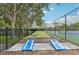 Outdoor recreation area with a bocce ball court, cornhole boards, and a tennis court at 1025 Seagrape Dr, Ruskin, FL 33570