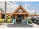 Inviting entrance to the Sunset Grille Beach Bar with tropical landscaping and a glimpse of the lively atmosphere inside at 1025 Seagrape Dr, Ruskin, FL 33570