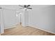 Relaxing bedroom with a ceiling fan, and access to the bathroom at 10265 Gandy N Blvd # 1406, St Petersburg, FL 33702