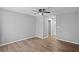 Spacious bedroom featuring wood-look floors and a ceiling fan for added comfort at 10265 Gandy N Blvd # 1406, St Petersburg, FL 33702