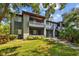 Attractive building exterior with lush landscaping and a sidewalk leading to the entrance at 10265 Gandy N Blvd # 1406, St Petersburg, FL 33702