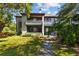 Charming building exterior with well-maintained landscaping and a welcoming entrance at 10265 Gandy N Blvd # 1406, St Petersburg, FL 33702