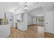 Modern kitchen with white cabinets and island, open to the living room at 10265 Gandy N Blvd # 1406, St Petersburg, FL 33702