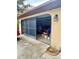 View of the garage featuring a sliding screen door and ample storage space at 11272 Portsmouth St, Spring Hill, FL 34609
