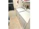 Laundry room featuring a side-by-side washer and dryer, and exterior door to the backyard at 11272 Portsmouth St, Spring Hill, FL 34609