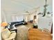 Cozy living room with neutral carpet, ceiling fan, and comfortable seating at 11272 Portsmouth St, Spring Hill, FL 34609