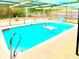 Inviting screened-in pool with clear blue water, ladder, and plenty of space for relaxing at 11272 Portsmouth St, Spring Hill, FL 34609