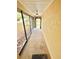 Inviting sunroom with lots of windows and a view of the front yard at 11272 Portsmouth St, Spring Hill, FL 34609
