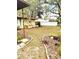 Landscaped yard featuring mature trees, garden beds, and well-maintained grass at 11272 Portsmouth St, Spring Hill, FL 34609