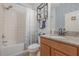 Functional bathroom featuring a vanity with granite countertop, updated fixtures, and tub-shower combo at 11938 Bahia Valley Dr, Riverview, FL 33579