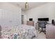 Comfortable bedroom with a ceiling fan, workspace, carpeted floor, and double door closet at 11938 Bahia Valley Dr, Riverview, FL 33579