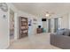 Upstairs living room with comfortable seating, shelving, entertainment unit, and access to other rooms at 11938 Bahia Valley Dr, Riverview, FL 33579