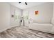 Serene bedroom featuring white walls, plantation shutters, and ceiling fan at 1237 Savona Ne Dr, St Petersburg, FL 33702