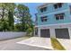 Charming townhouse exterior with a private garage, paver driveway, and easy-to-maintain landscaped grounds at 1237 Savona Ne Dr, St Petersburg, FL 33702