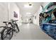Expanded garage space featuring room for bicycles, paddle boards, and a lounge area at 1237 Savona Ne Dr, St Petersburg, FL 33702