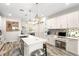 Gourmet kitchen featuring a large island, custom cabinetry, and an adjacent workspace for added convenience at 1237 Savona Ne Dr, St Petersburg, FL 33702
