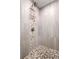 Elegant shower featuring a mosaic tile accent stripe, a built in bench, and modern fixtures at 1237 Savona Ne Dr, St Petersburg, FL 33702