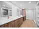 Modern bathroom features a double vanity with wood cabinets, white countertop, and a glass-enclosed shower at 1520 Gulf Blvd # 404, Clearwater, FL 33767