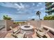 Relaxing outdoor fire pit area with comfortable seating and beautiful ocean views, perfect for enjoying evenings at 1520 Gulf Blvd # 404, Clearwater, FL 33767