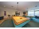Inviting game room featuring two billiard tables, artwork, and comfortable seating for entertainment at 1520 Gulf Blvd # 404, Clearwater, FL 33767