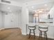 Kitchen island with seating, stainless steel appliances, custom cabinets, and recessed lighting at 1520 Gulf Blvd # 404, Clearwater, FL 33767