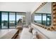 Living room featuring hardwood floors, a comfortable couch, and a window view of the beach at 1520 Gulf Blvd # 404, Clearwater, FL 33767