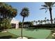 Well-manicured putting green surrounded by lush landscaping, perfect for golf enthusiasts and relaxation at 1520 Gulf Blvd # 404, Clearwater, FL 33767
