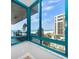 Bright window view showcasing the beach and adjacent buildings of the neighborhood at 1520 Gulf Blvd # 404, Clearwater, FL 33767