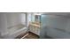 Elegant bathroom with granite countertops, soaking tub, and a glass-enclosed shower at 15209 Arbor Hollow Dr, Odessa, FL 33556