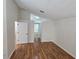 Clean, neutral bedroom with hardwood floors and white walls; ready for personal touch at 15209 Arbor Hollow Dr, Odessa, FL 33556