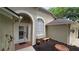 Welcoming front entryway with a charming archway and manicured landscaping at 15209 Arbor Hollow Dr, Odessa, FL 33556