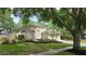 Charming single-story home with well-manicured lawn and mature landscaping at 15209 Arbor Hollow Dr, Odessa, FL 33556