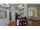 Bright kitchen features a breakfast bar, skylights, stainless steel appliances, and cream colored cabinets at 15209 Arbor Hollow Dr, Odessa, FL 33556