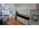 Charming kitchen with black countertops and stainless steel appliances, leading to a pool view at 15209 Arbor Hollow Dr, Odessa, FL 33556