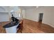 Open-concept living space with wood flooring, archways, and seamless flow from kitchen at 15209 Arbor Hollow Dr, Odessa, FL 33556