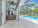 Enjoy outdoor living on this spacious lanai with serene views of the pool at 17205 Tiffany Shore Dr, Lutz, FL 33549