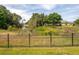 Pictureque pond with a black metal fence providing a view of the pond at 17205 Tiffany Shore Dr, Lutz, FL 33549