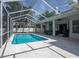 Inviting screened pool with an open-air lanai and elegant outdoor living space at 17205 Tiffany Shore Dr, Lutz, FL 33549