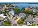 A residential area with waterfront homes, palm trees, and lush foliage in a desirable neighborhood at 1739 1/2 Bayou Grande Ne Blvd, St Petersburg, FL 33703
