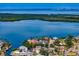 Stunning aerial view of waterfront homes with a bay and islands in the background at 1739 1/2 Bayou Grande Ne Blvd, St Petersburg, FL 33703