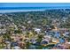 Expansive aerial view highlights waterfront homes with boat docks, lush greenery, and a serene water backdrop at 1739 1/2 Bayou Grande Ne Blvd, St Petersburg, FL 33703