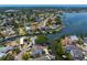 Scenic aerial view of waterfront houses with boat access, lush trees and private pools at 1739 1/2 Bayou Grande Ne Blvd, St Petersburg, FL 33703