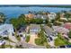 A residential area with homes, palm trees, and lush foliage next to a body of water at 1739 1/2 Bayou Grande Ne Blvd, St Petersburg, FL 33703