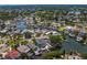 High angle shot of a residential area with canals, docks, and tree-lined streets at 1739 1/2 Bayou Grande Ne Blvd, St Petersburg, FL 33703
