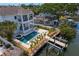Stunning waterfront property featuring a pool, spa, and private boat dock for ultimate relaxation and recreation at 1739 1/2 Bayou Grande Ne Blvd, St Petersburg, FL 33703