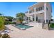 Gorgeous two-story home with a backyard featuring a luxurious pool and covered balconies at 1739 1/2 Bayou Grande Ne Blvd, St Petersburg, FL 33703